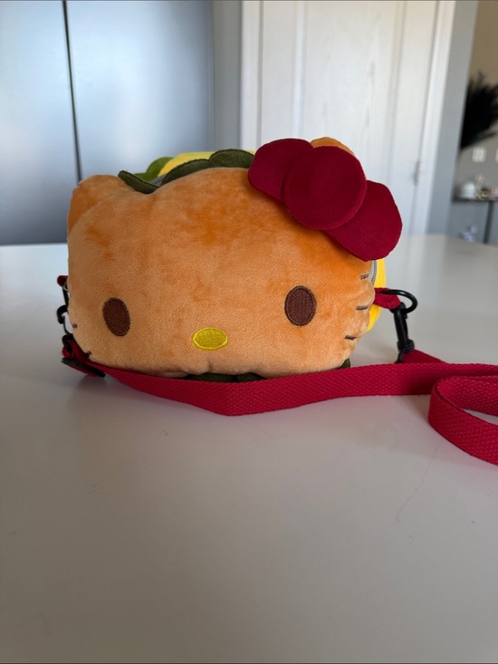 Sanrio Handbags - Sanrio Hello Kitty Plush Crossbody Bag in Orange with Red Bow